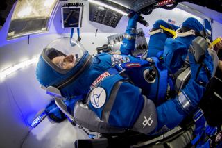 Chris Ferguson Tries On Boeing Blue Spacesuit