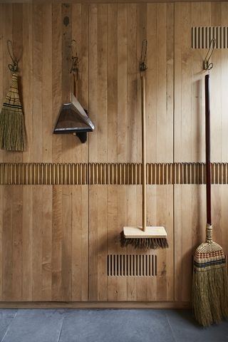 utility room design with wood panelled wall