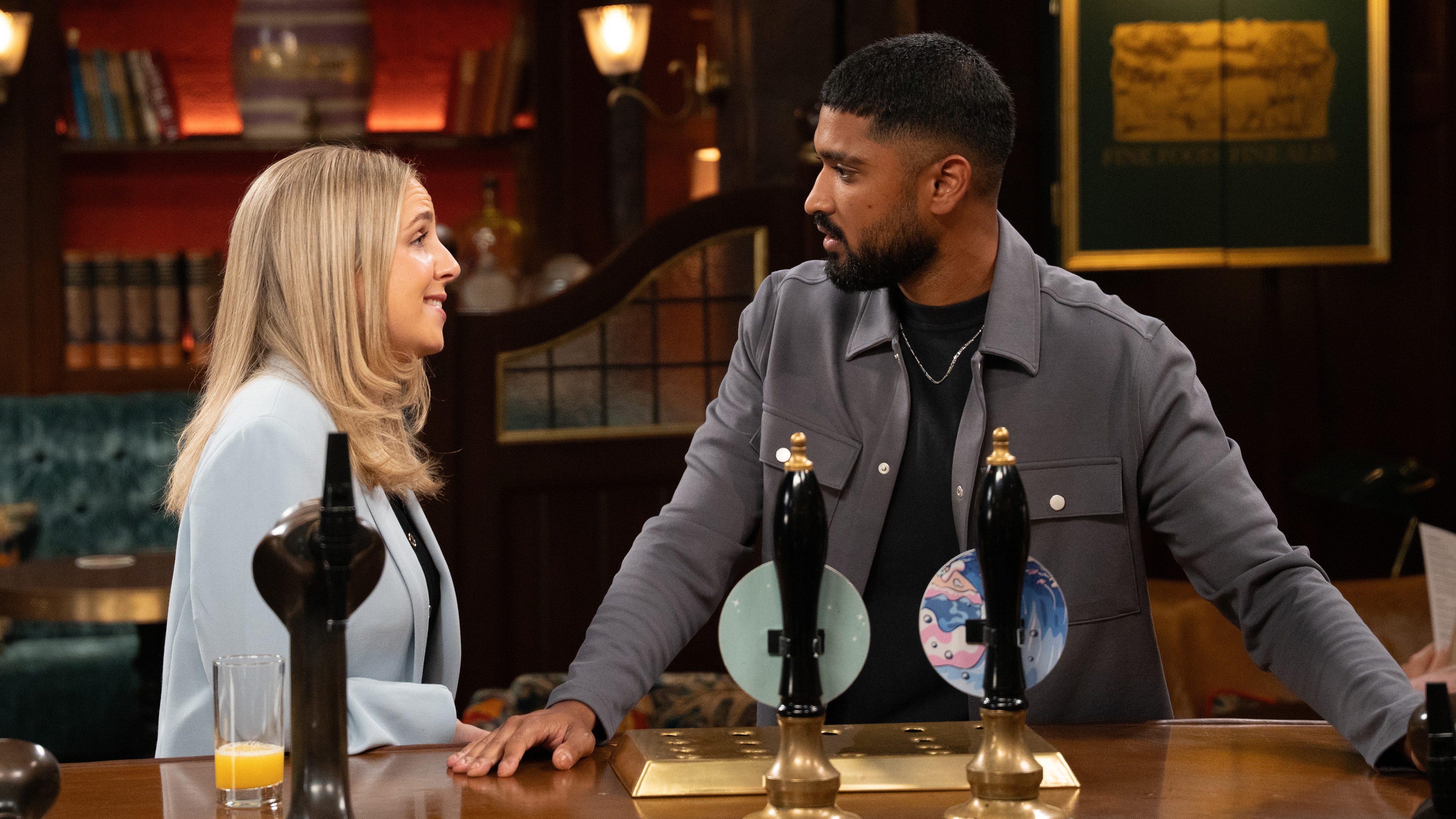 Belle and Kammy talking to each other at the bar