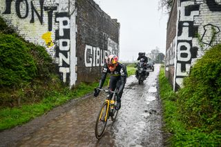 Wout van Aert rides through the famous 'Pont Gibus' while previewing the 2023 Paris-Roubaix route