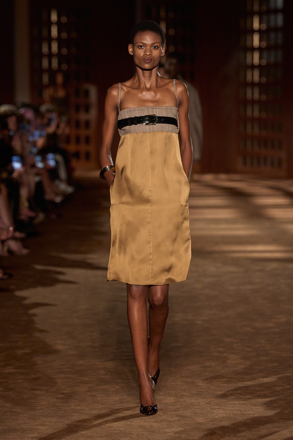 a model walks the ferragamo spring 2027 runway.