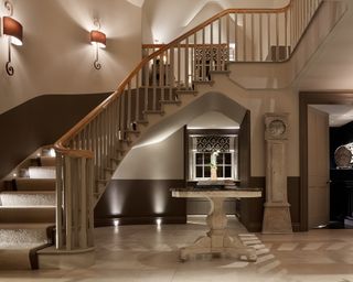 Layered lighting in hallway with staircase lighting ideas by John Cullen Lighting