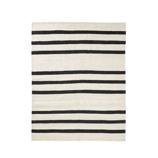 A white rug with black stripes