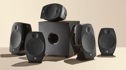 Focal Sib Evo speaker system unboxed on yellow background