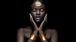 Portrait of an Afro-American woman wearing gold bangles