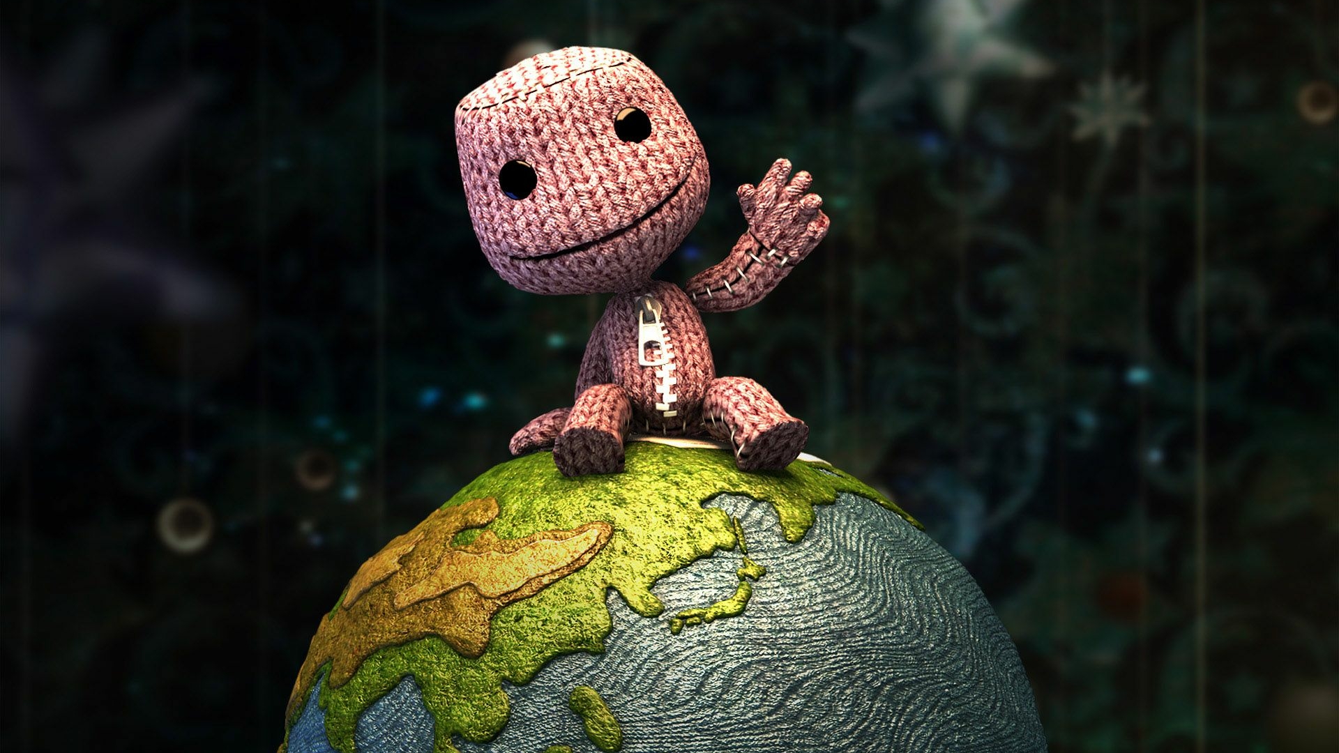 best PSP games: Sackboy sitting on a globe and waving