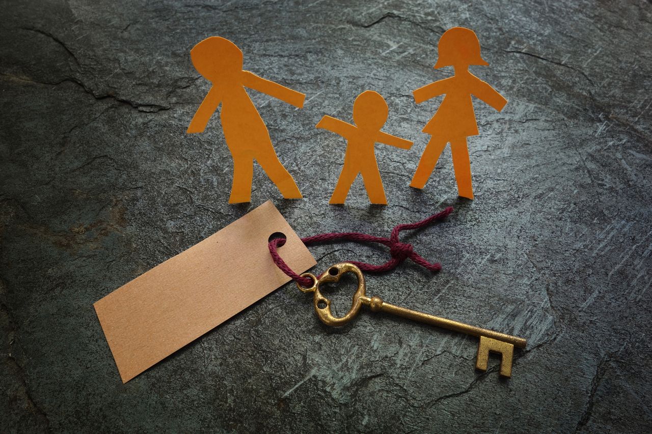 Paper family and gold key