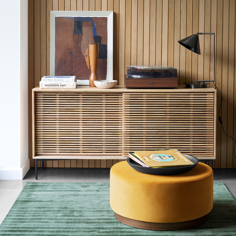 wooden panel wall weaving sideboard mango colour table books in plate and lamp