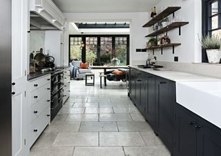 a small orangerie kitchen extension has transformed the use of this galley kitchen