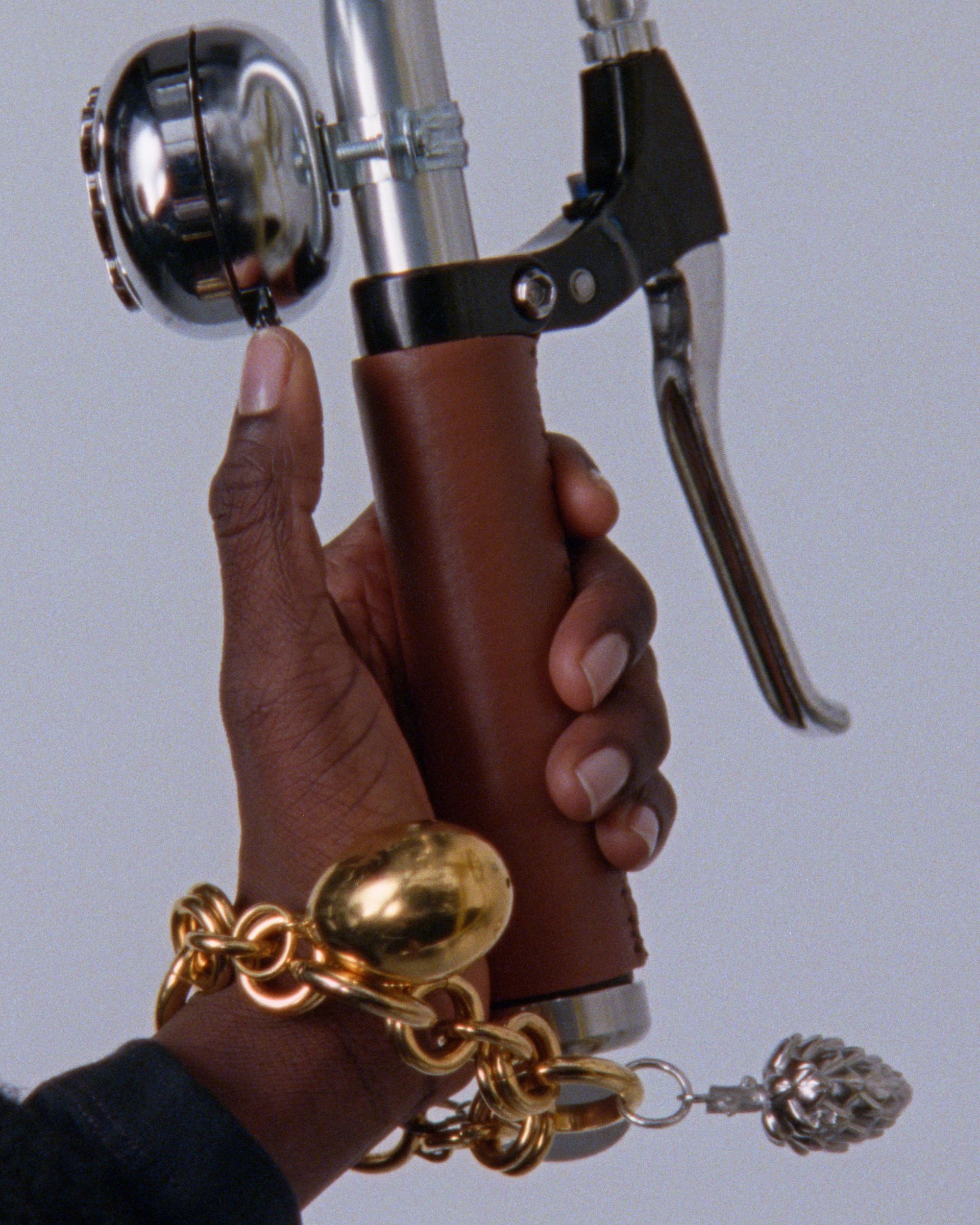 Celine charms on a bracelet.