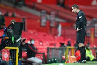 Referee David Coote consults VAR before overturning his decision to award West Bromwich Albion a penalty for a foul on West Brom