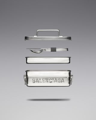 Balenciaga stainless steel lunchbox on grey background