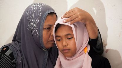 Indonesian girl reunited with her mother in Meulaboh