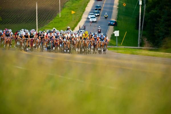 More than 80 women race in a tight pack during stage 3 of the Nature Valley Grand Prix. They covered 66 miles in a little more than 2 hours and 38 minutes.