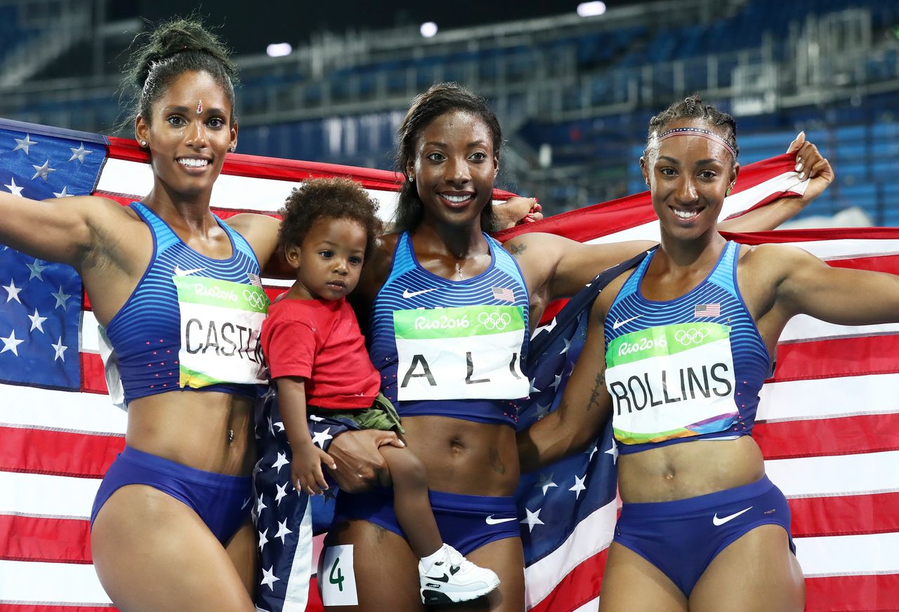 Kristi Castlin, Nia Ali and Brianna Rollins of the United States pose with the American flag