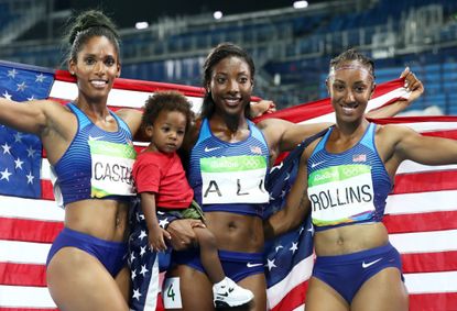 Kristi Castlin, Nia Ali and Brianna Rollins of the United States pose with the American flag