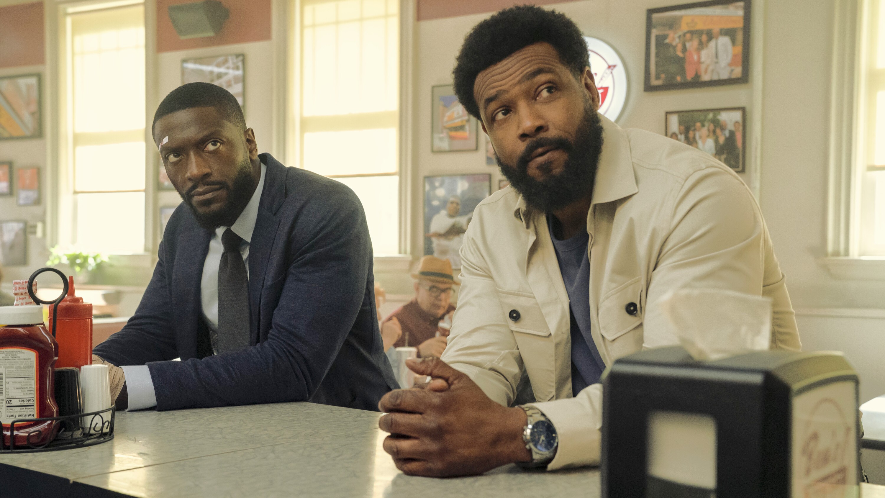 (L-R) Aldis Hodge and Isaiah Mustafa in "Cross" season 2 on Prime Video.