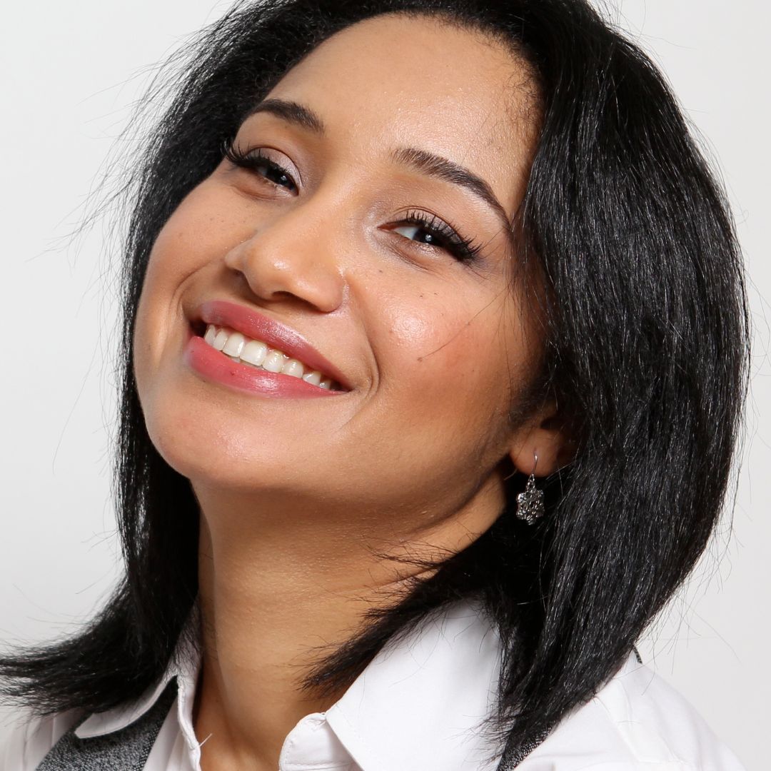 A professional headshot of flight attendant Aura E. Martinez.