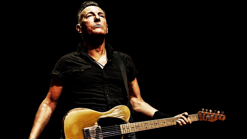 A press image of Bruce Springsteen with a guitar promoting Road Diary: Bruce Springsteen and the E Street Band