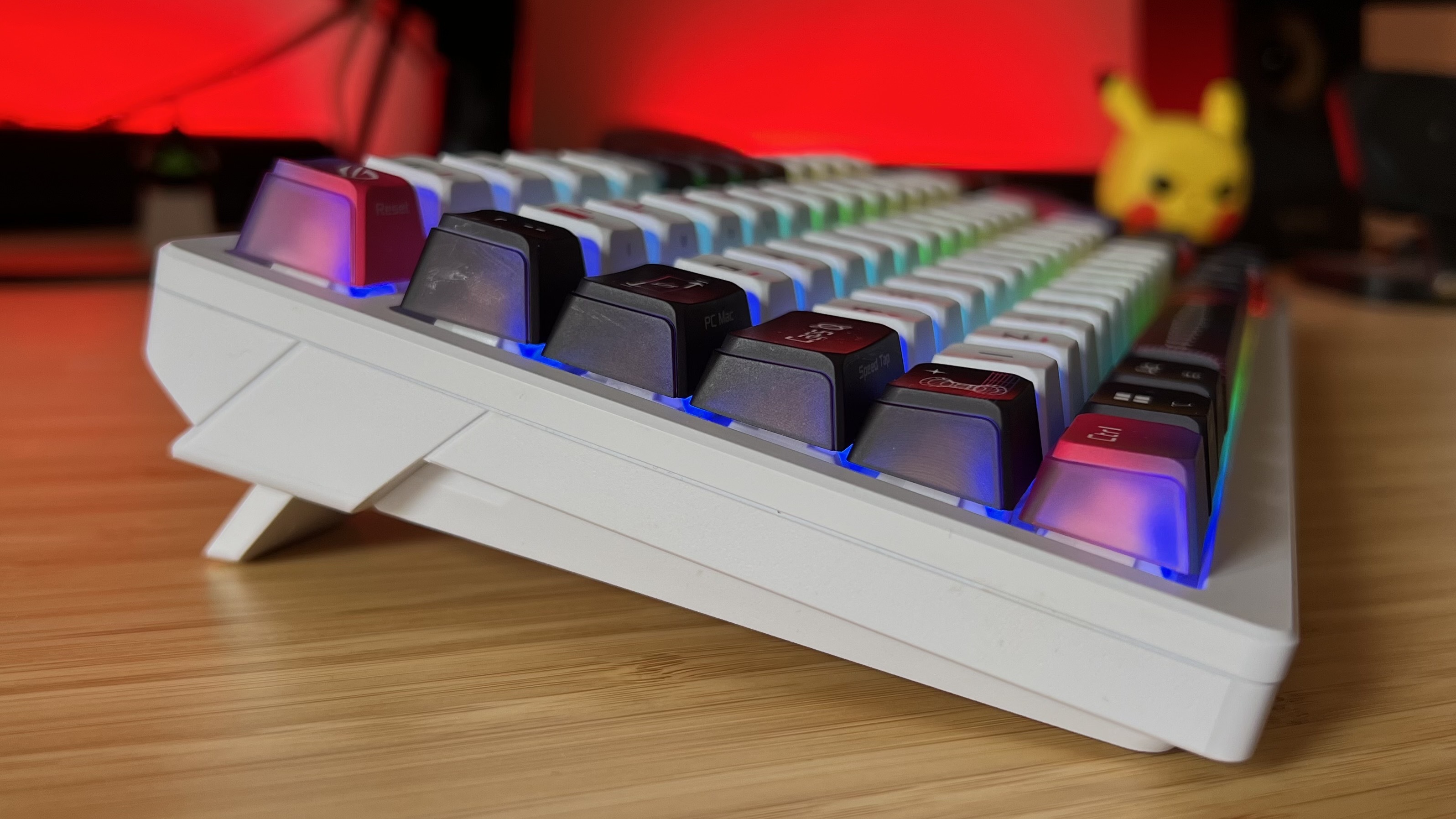 Side view of Asus ROG Azoth X gaming keyboard showing elevation feet kicked out