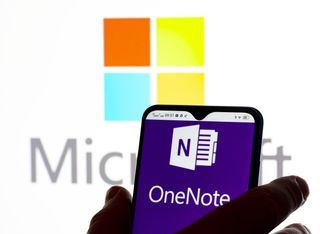 OneNote logo on a smartphone against white background with Windows logo on it
