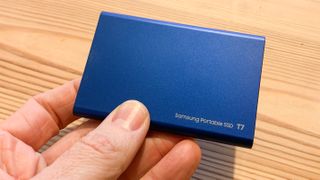 Samsung T7 SSD held in a hand