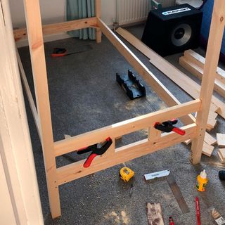 raw wooden frame bed