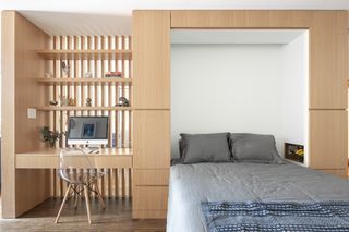 A bedroom folds away into the cabinet