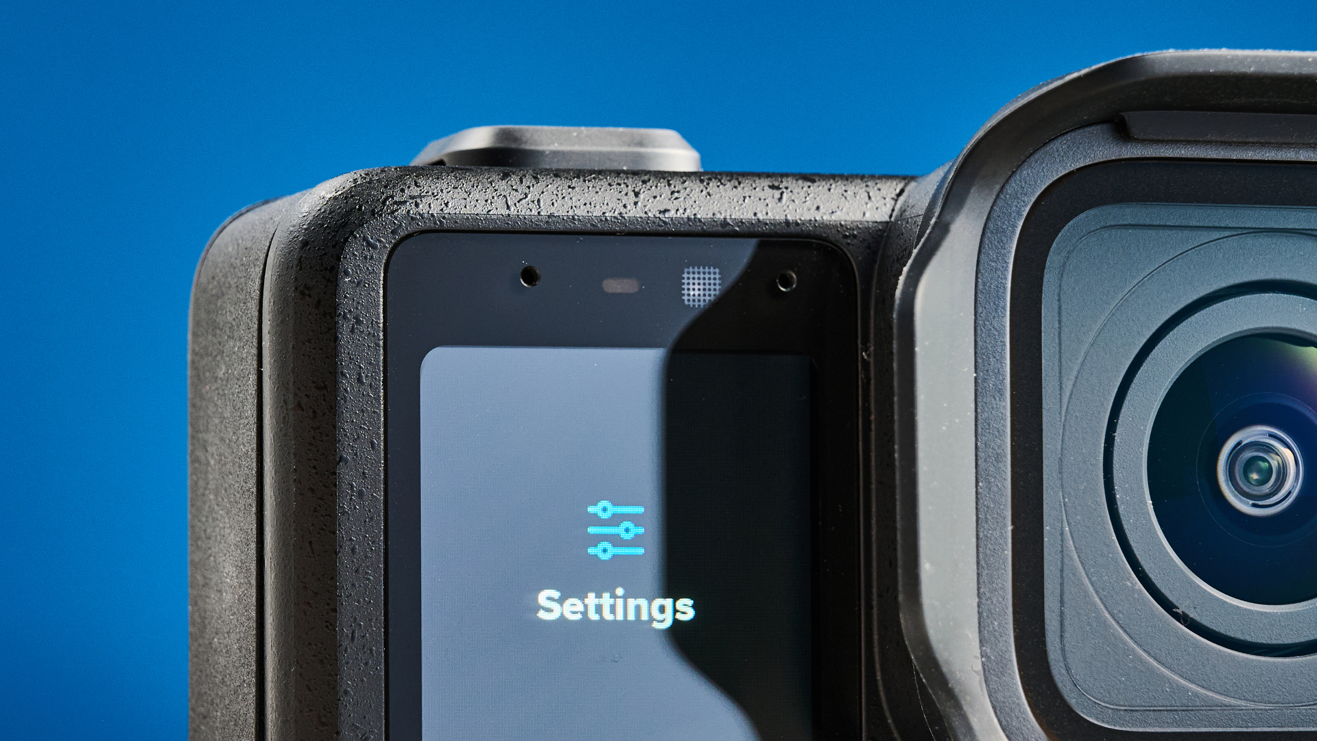 The GoPro Mission 1 Pro front screen against a blue background