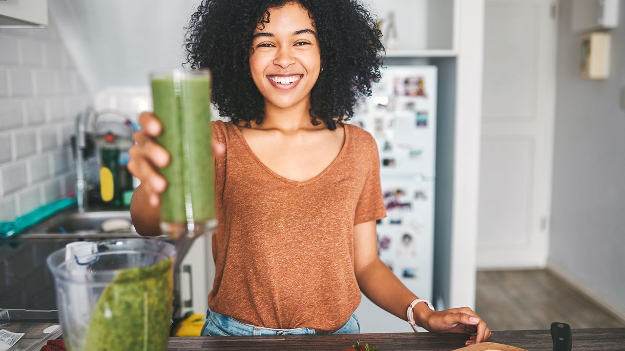 Woman preparing a healthy smoothie