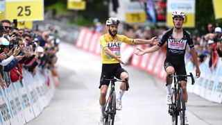 VILLARS-SUR-OLLON, SWITZERLAND - JUNE 15: (L-R) Stage winner Adam Yates of The United Kingdom and UAE Team Emirates - Yellow Leader Jersey and Joao Almeida of Portugal and UAE Team Emirates - Black Points Jersey cross the finish line during the 87th Tour de Suisse 2024, Stage 7 a 118.2km stage from Villars-sur-Ollon to Villars-sur-Ollon 1248m / #UCIWT / on June 15, 2024 in Villars-sur-Ollon, Switzerland. (Photo by Tim de Waele/Getty Images)