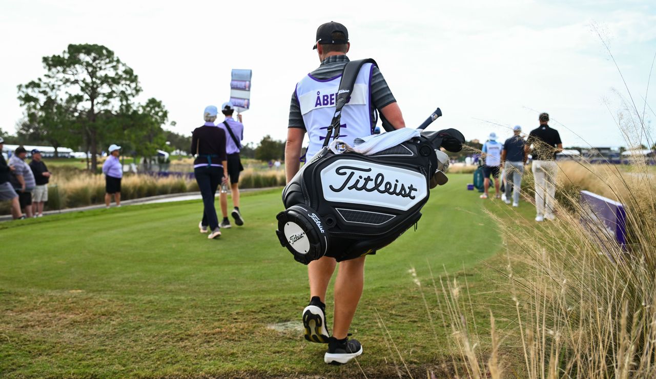 Ludvig Aberg&#039;s caddie walks down the fairway