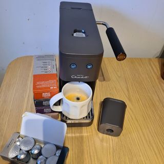 Hotel Chocolat Podster with coffee pods in a box on a wooden table