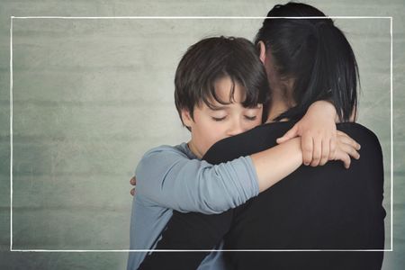 boy hugging woman