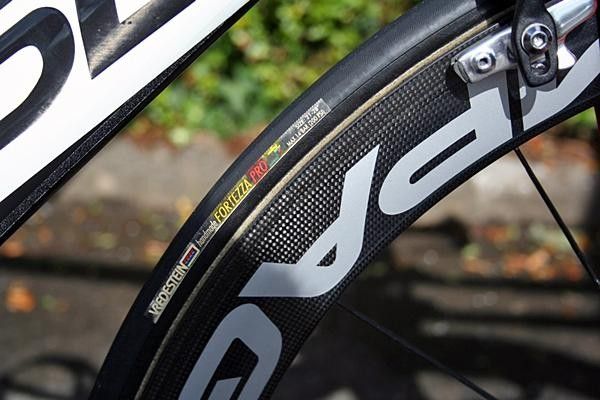 Wrapped around the wheels are a set of Vredestein Fortezza Pro tubulars.
