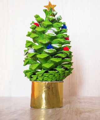 Christmas tree made with green painted pine cone