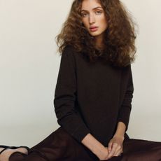 A Reformation model wearing a cashmere sweater from the fall 2025 new arrivals.