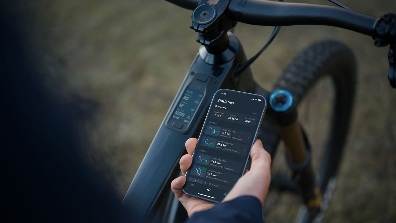 A phone connected to the DJI Amivox e-bike system