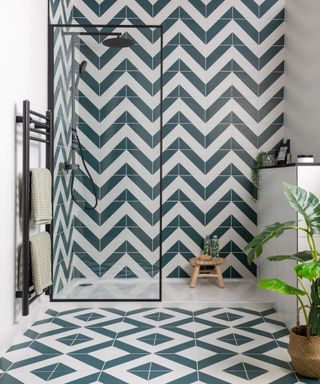shower area with contrasting green and white wall and floor tiles