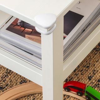 A coffee table with corner guards for safety