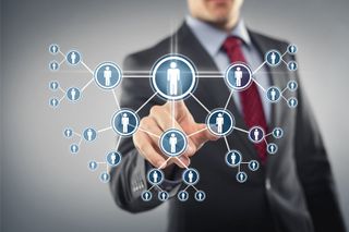 Man in suit with graphic representing people in a network