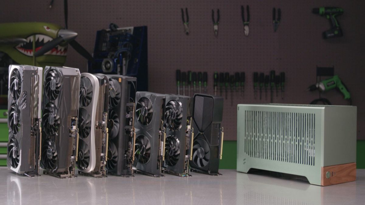 A set of Nvidia RTX graphics cards next to a compact PC case.