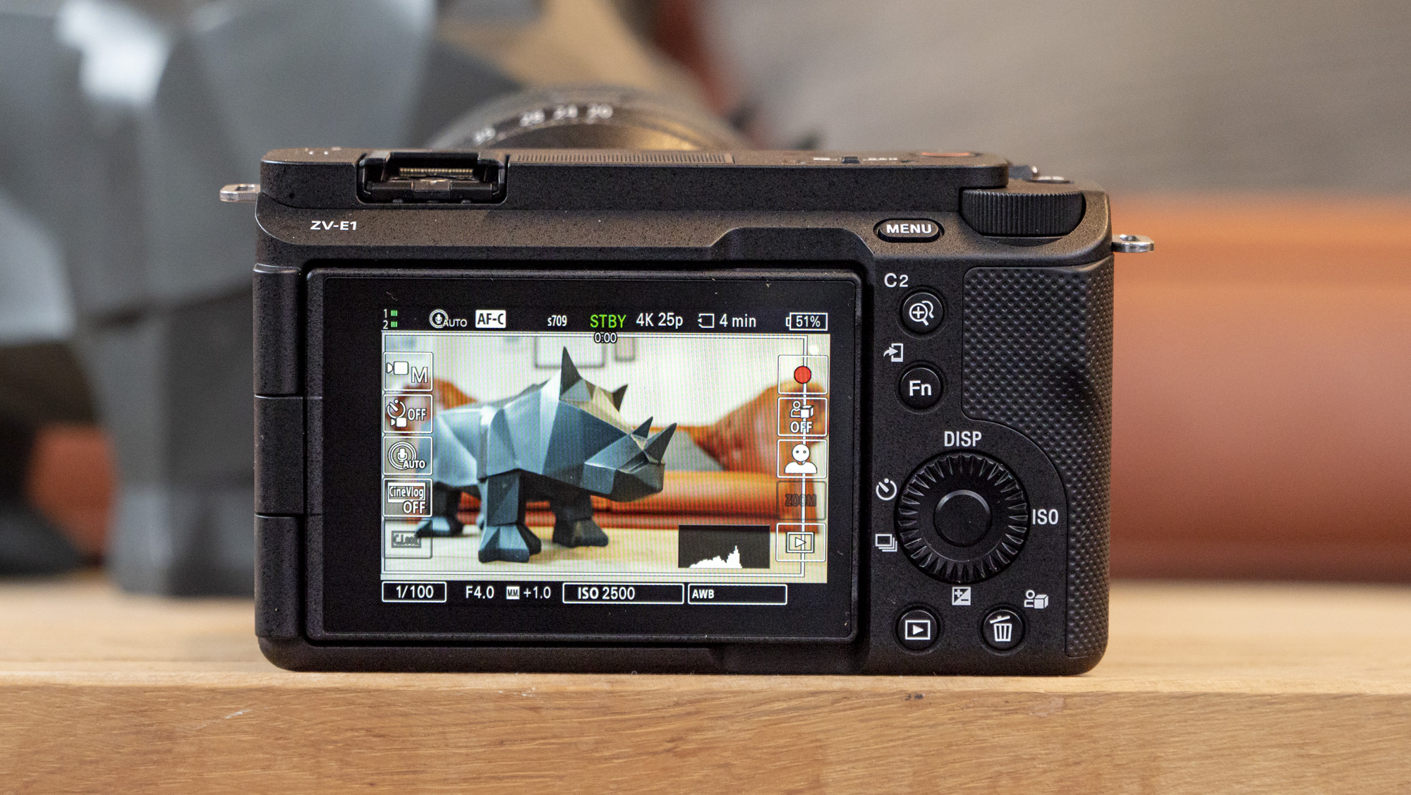 The Sony ZV-E1 camera sitting on a wooden table