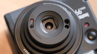 Fujifilm Instax Mini 99 instant camera lens close up