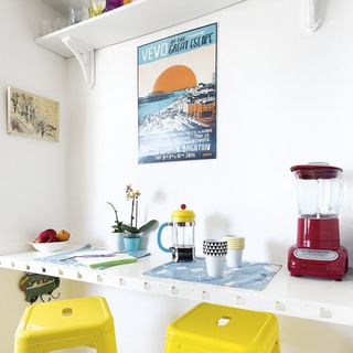 white dining room with table and yellow chair