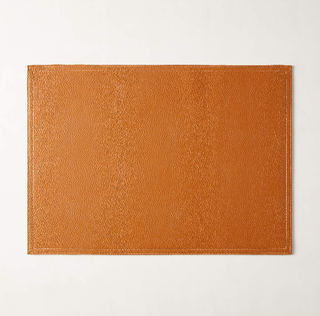 Saddle brown faux leather placemat.