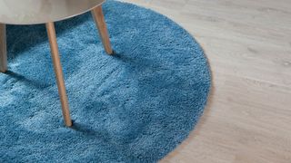Table legs on blue rug