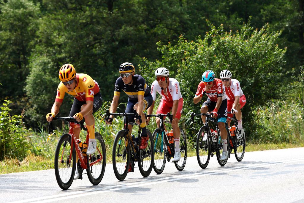 LUBLIN POLAND JULY 30 LR Jonas Abrahamsen of Norway and UNO X Pro Cycling Team Sam Brand of United Kingdom and Team Novo Nordisk Patryk Stosz of Poland and Team Poland Kamil Malecki of Poland and Team Lotto Soudal and Mateusz Grabis of Poland and Team Poland compete in the breakaway during the 79th Tour de Pologne 2022 Stage 1 a 2188km stage from Kielce to Lublin TdP22 WorldTour on July 30 2022 in Lublin Poland Photo by Bas CzerwinskiGetty Images