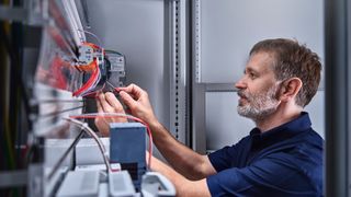 Electrician inspecting circuitry