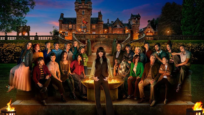 A wide shot of the cast of The Traitors Season 4 UK along with host Claudia Winkleman, photographed against stately Ardross Castle in Scotland as night falls and the carnage begins.
